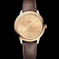 34 mm, steel ‑ yellow gold on leather strap